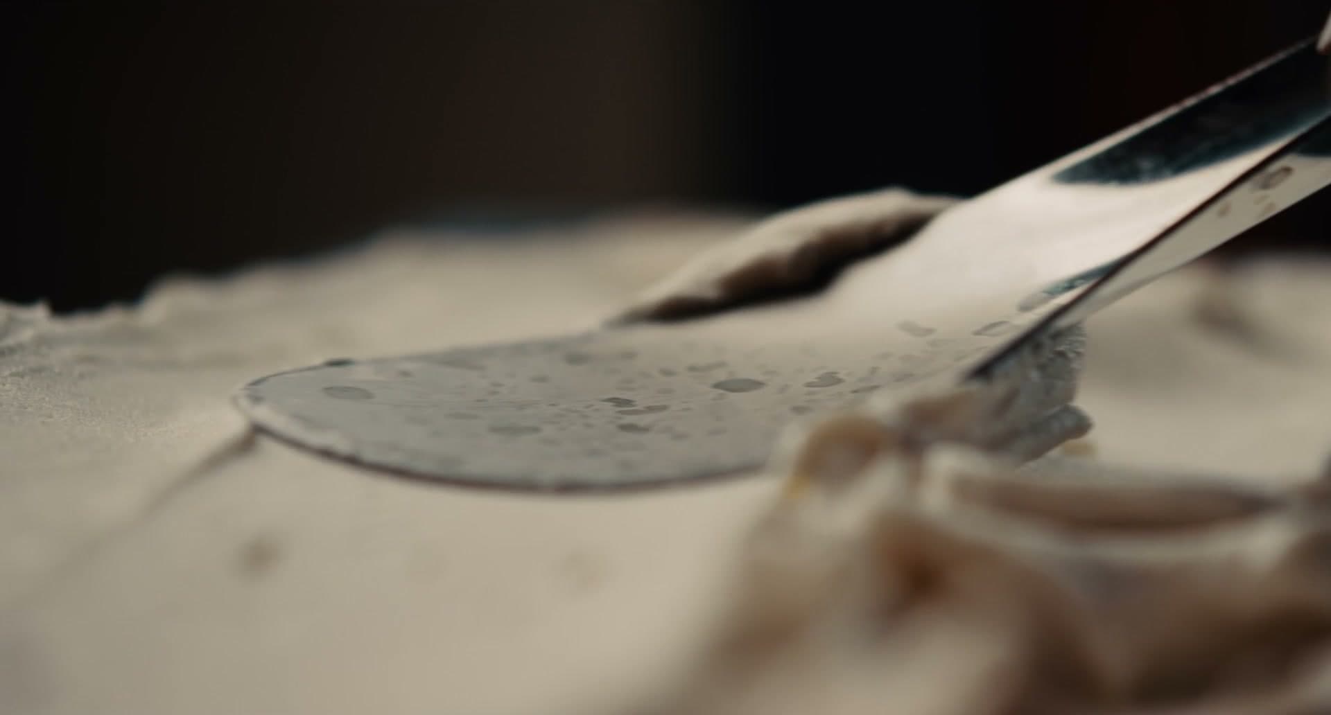 A spatula drawn through the cream
